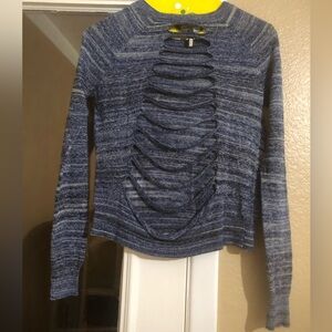 BCBG.  A fun blue sweater with open/cut out back